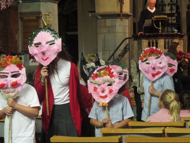 Masks made for Peter and the Wolf modelled by school children