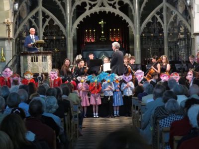 Audience and children performing