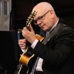 Colin Oxley playing guitar Colin Oxley playing guitar