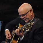 Colin Oxley playing guitar